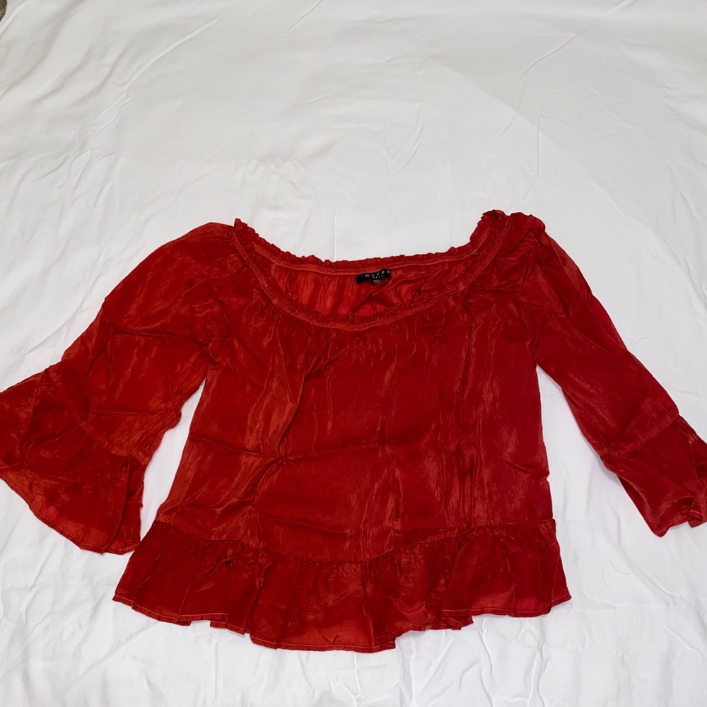 Maven West off the should top